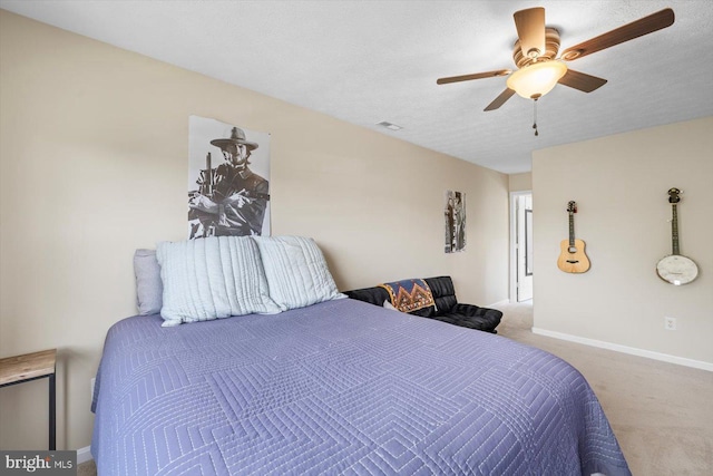 1104 Century Oak Dr, Fredericksburg, VA 22401 - carpeted bedroom with baseboards, ceiling fan, and a textured ceiling