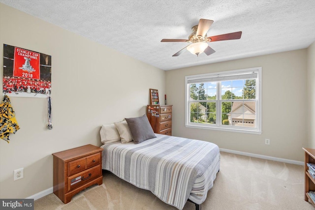 1104 Century Oak Dr, Fredericksburg, VA 22401 - bedroom featuring baseboards, light carpet, a textured ceiling, and ceiling fan