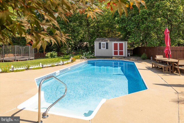 1104 Century Oak Dr, Fredericksburg, VA 22401 - view of pool with a trampoline, a patio area, a fenced backyard, and outdoor dining area