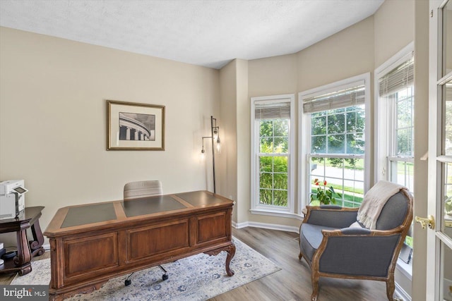 1104 Century Oak Dr, Fredericksburg, VA 22401 - office area featuring wood finished floors, baseboards, and a textured ceiling