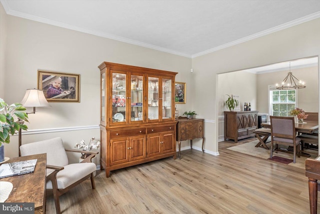 1104 Century Oak Dr, Fredericksburg, VA 22401 - living area featuring light wood-type flooring, a chandelier, crown molding, and baseboards