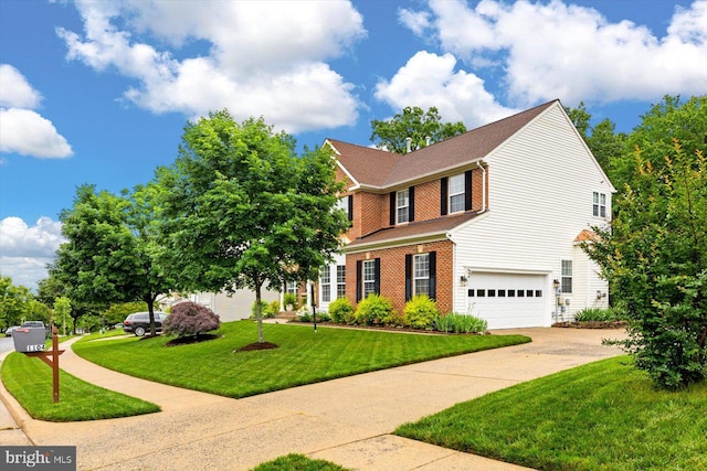 1104 Century Oak Dr, Fredericksburg, VA 22401 - view of front of property featuring a garage, driveway, brick siding, and a front yard