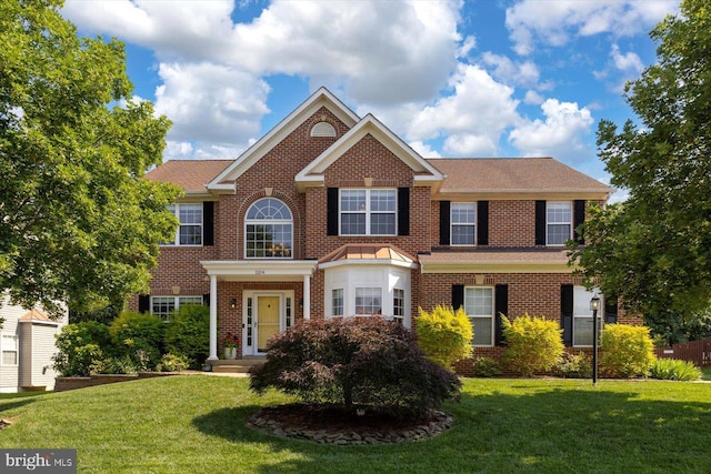1104 Century Oak Dr, Fredericksburg, VA 22401 - colonial inspired home with a front yard and brick siding