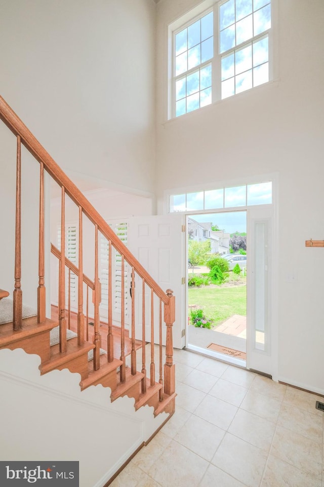 1421 Pickett Ct, Front Royal, VA 22630 - tiled entrance foyer featuring a towering ceiling and stairway