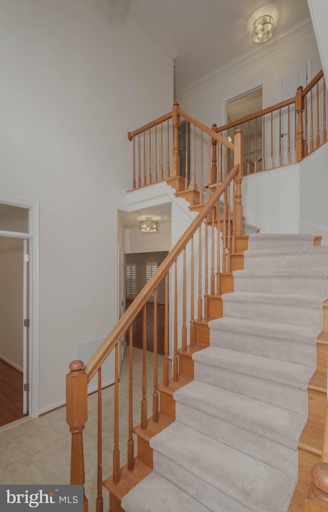 1421 Pickett Ct, Front Royal, VA 22630 - staircase with crown molding, a high ceiling, and wood finished floors