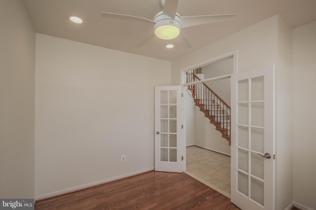 1421 Pickett Ct, Front Royal, VA 22630 - unfurnished room featuring french doors, wood finished floors, ceiling fan, stairway, and recessed lighting