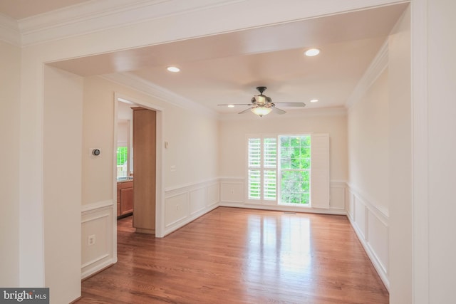 1421 Pickett Ct, Front Royal, VA 22630 - spare room featuring ornamental molding, ceiling fan, a decorative wall, a wainscoted wall, and light wood-type flooring