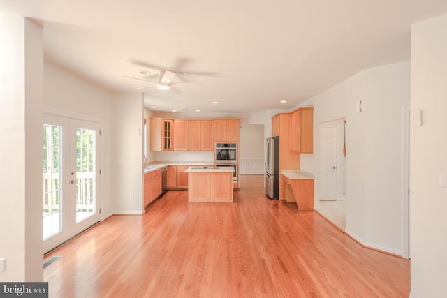 1421 Pickett Ct, Front Royal, VA 22630 - kitchen with light brown cabinets, stainless steel appliances, light countertops, light wood finished floors, and ceiling fan