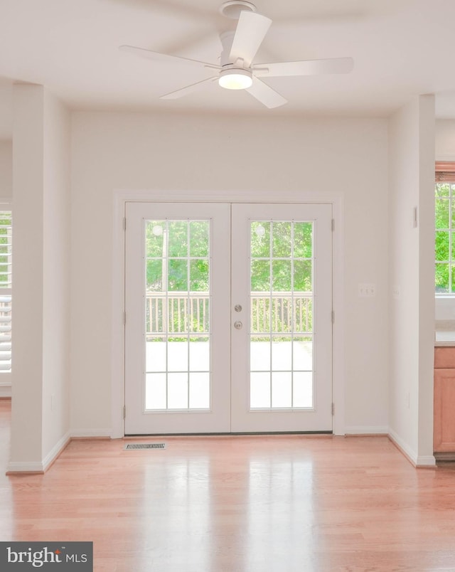 1421 Pickett Ct, Front Royal, VA 22630 - doorway with light wood-style floors, a ceiling fan, and french doors