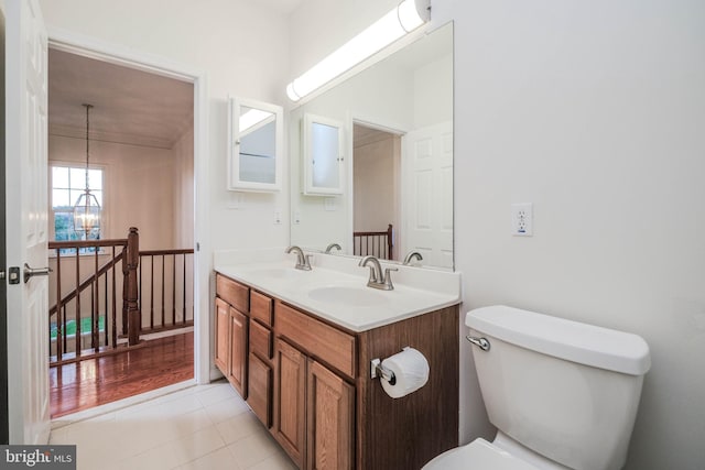 1421 Pickett Ct, Front Royal, VA 22630 - bathroom featuring double vanity, a chandelier, tile patterned flooring, and crown molding