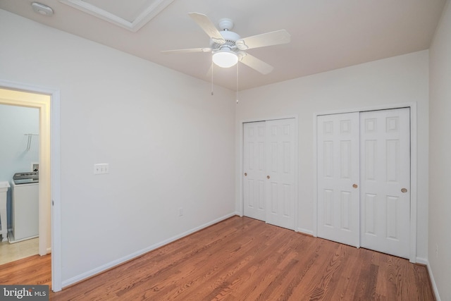 1421 Pickett Ct, Front Royal, VA 22630 - unfurnished bedroom with multiple closets, light wood-style flooring, washer / clothes dryer, and ceiling fan