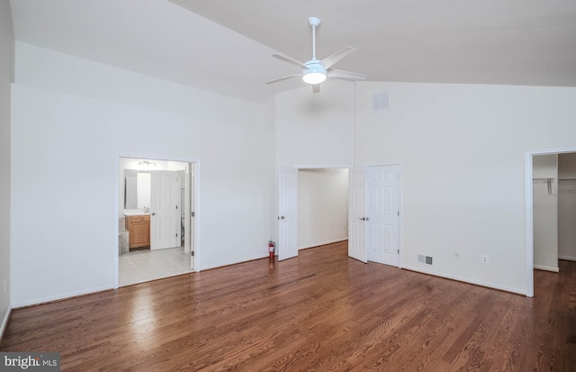 1421 Pickett Ct, Front Royal, VA 22630 - unfurnished bedroom featuring high vaulted ceiling, wood finished floors, connected bathroom, and a ceiling fan