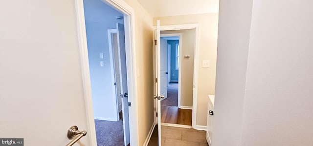 3 New Coach Ln, Willingboro, NJ 08046 - corridor with baseboards and light tile patterned floors
