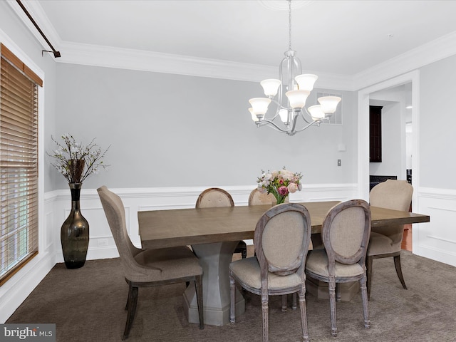 13801 Racetrack Field Ct, Bowie, MD 20720 - carpeted dining space with a chandelier, wainscoting, crown molding, a decorative wall, and healthy amount of natural light