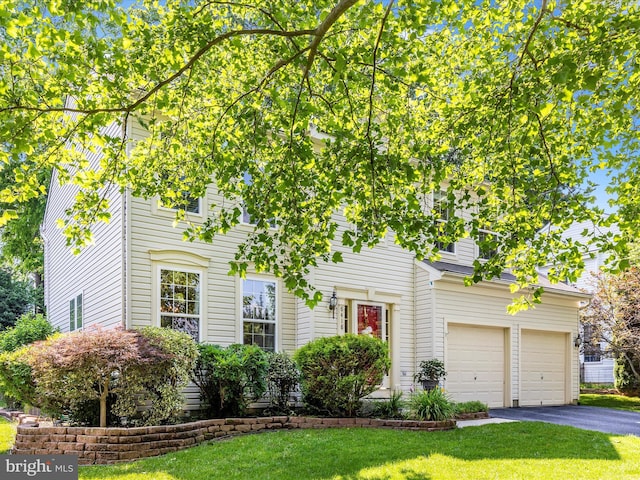 6418 Flintlock Ct, Eldersburg, MD 21784 - view of front of house with asphalt driveway, a garage, and a front lawn