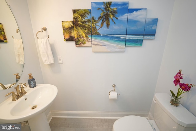 36063 Auburn Way, Millsboro, DE 19966 - half bathroom featuring toilet, baseboards, and a sink