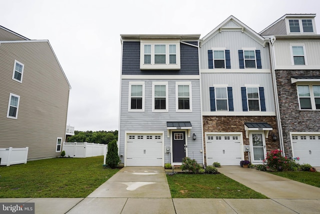 36063 Auburn Way, Millsboro, DE 19966 - townhome / multi-family property featuring board and batten siding, stone siding, and concrete driveway