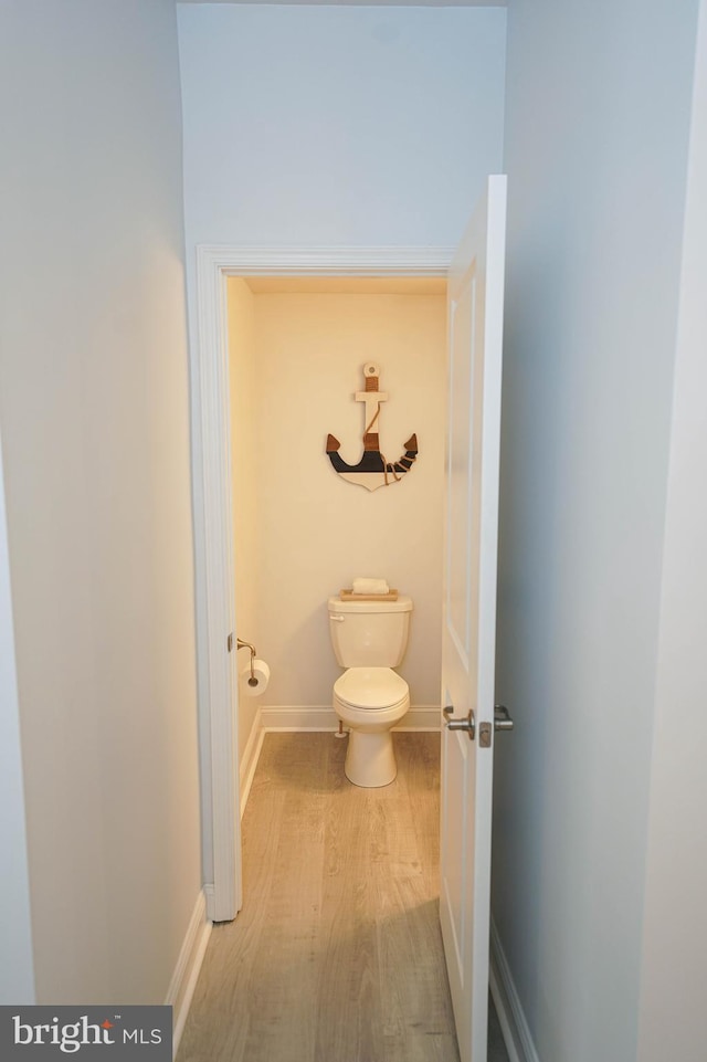 36063 Auburn Way, Millsboro, DE 19966 - bathroom featuring baseboards, wood finished floors, and toilet