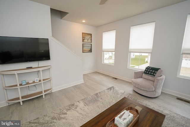 36063 Auburn Way, Millsboro, DE 19966 - living area with wood finished floors, healthy amount of natural light, baseboards, stairs, and recessed lighting