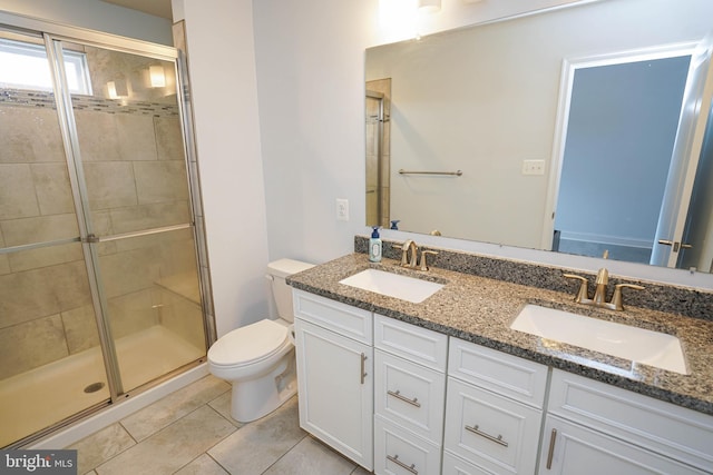 36063 Auburn Way, Millsboro, DE 19966 - bathroom featuring toilet, a shower stall, double vanity, and tile patterned floors