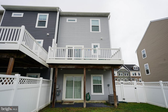 36063 Auburn Way, Millsboro, DE 19966 - rear view of house with a fenced backyard, central air condition unit, a deck, and a gate