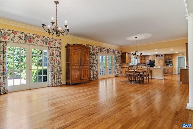 5190 Sugar Ridge Rd, Crozet, VA 22932 - living room featuring a chandelier, french doors, ornamental molding, and light wood-style flooring