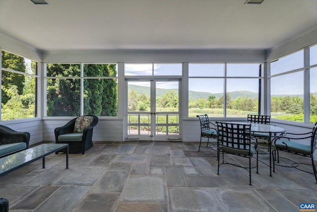 5190 Sugar Ridge Rd, Crozet, VA 22932 - sunroom featuring stone tile floors and a mountain view