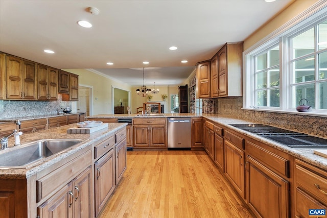 5190 Sugar Ridge Rd, Crozet, VA 22932 - kitchen with dishwasher, a sink, light wood finished floors, brown cabinetry, and a chandelier