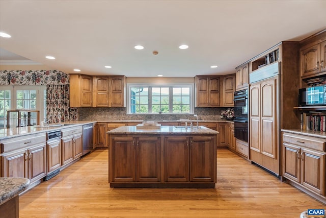 5190 Sugar Ridge Rd, Crozet, VA 22932 - kitchen featuring dishwasher, a kitchen island with sink, light wood finished floors, light stone counters, and recessed lighting