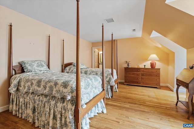 5190 Sugar Ridge Rd, Crozet, VA 22932 - bedroom with wood finished floors, baseboards, and a skylight