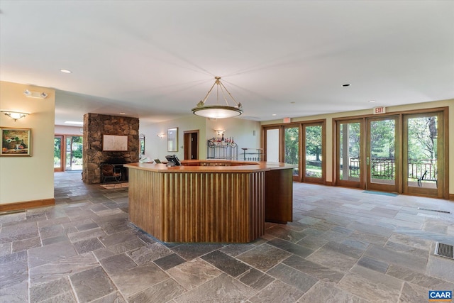 5190 Sugar Ridge Rd, Crozet, VA 22932 - kitchen featuring open floor plan, a kitchen island, baseboards, stone tile floors, and recessed lighting