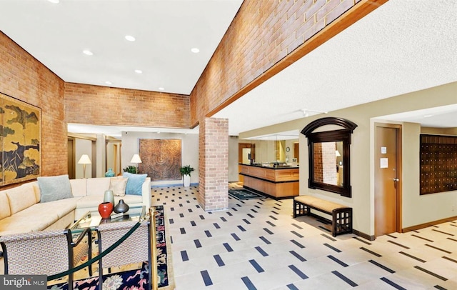 111 Hamlet Hill Rd Unit 707, Baltimore, MD 21210 - lobby with brick wall, recessed lighting, and a high ceiling