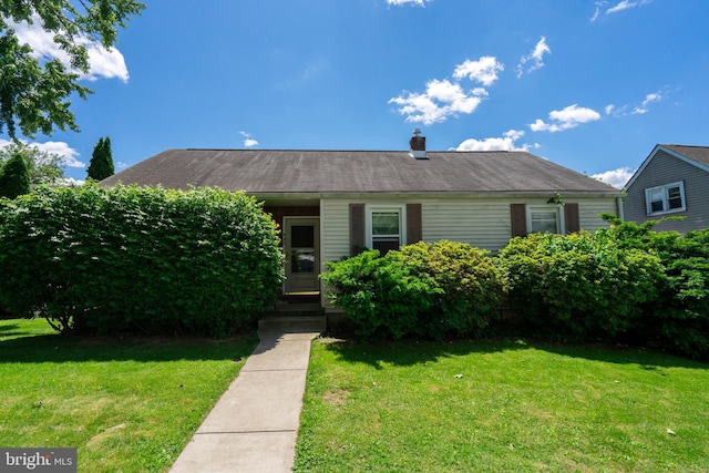 940 Marion St, Bethlehem, PA 18017 - view of front of house with a front yard and a chimney
