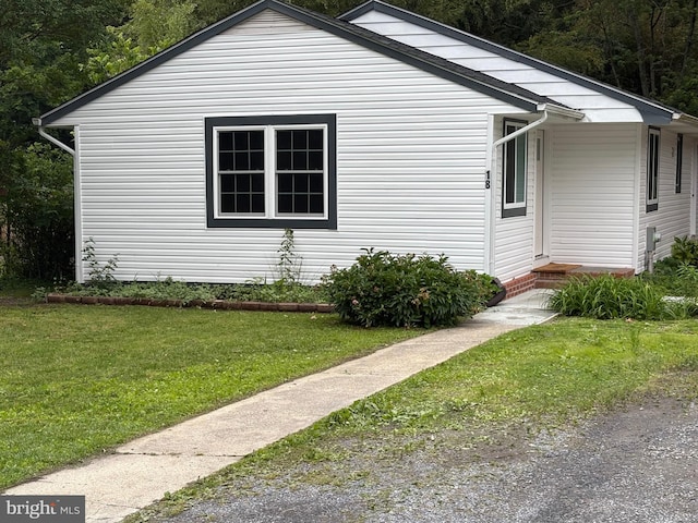 view of home's exterior featuring a yard