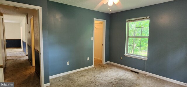 30120 Dudley Rd, Mechanicsville, MD 20659 - unfurnished bedroom with carpet floors, a walk in closet, baseboards, and a closet