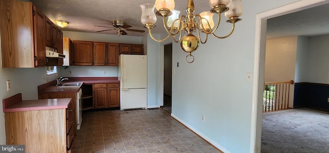 30120 Dudley Rd, Mechanicsville, MD 20659 - kitchen featuring freestanding refrigerator, a sink, a ceiling fan, under cabinet range hood, and brown cabinets