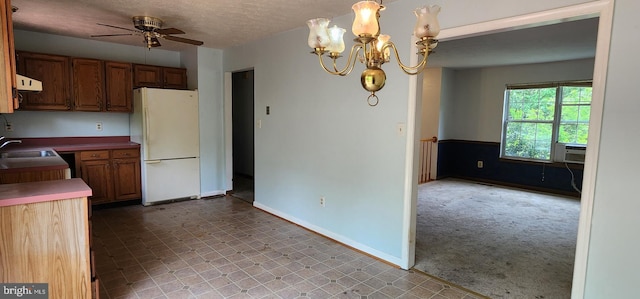 30120 Dudley Rd, Mechanicsville, MD 20659 - kitchen with freestanding refrigerator, ceiling fan, a chandelier, light carpet, and a sink