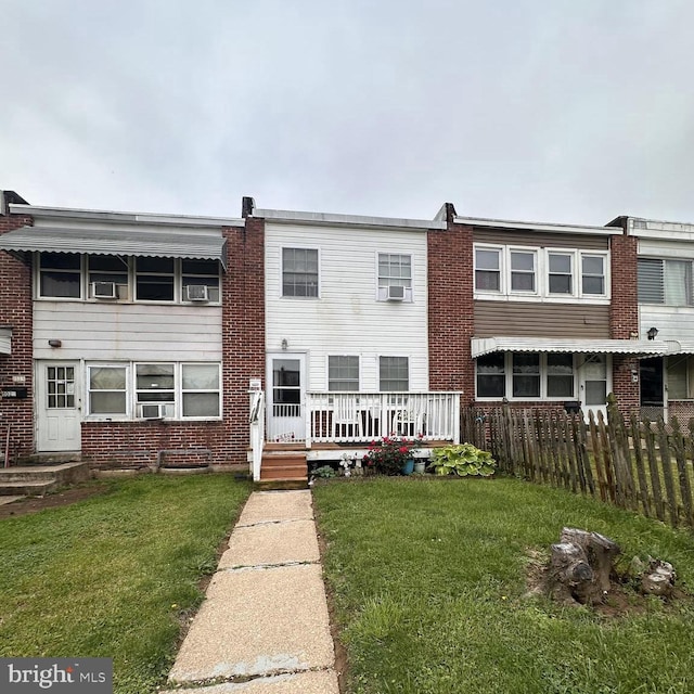 8023 Wynbrook Rd, Baltimore, MD 21224 - view of front of house with brick siding and cooling unit