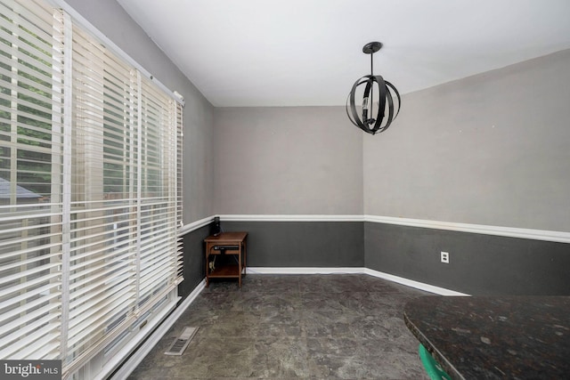 12329 Manchester Way, Woodbridge, VA 22192 - unfurnished dining area with baseboards and a chandelier