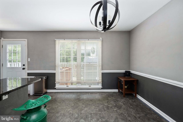 12329 Manchester Way, Woodbridge, VA 22192 - unfurnished dining area featuring a chandelier and baseboards