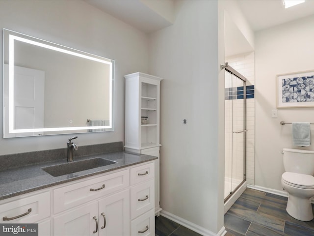 84 Sage Pl, Shepherdstown, WV 25443 - bathroom with toilet, a stall shower, vanity, and baseboards