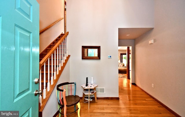 2415 Schaffer Rd, Pottstown, PA 19464 - foyer with wood finished floors, stairway, baseboards, and a high ceiling