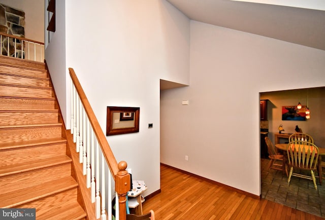 2415 Schaffer Rd, Pottstown, PA 19464 - stairway featuring a high ceiling, wood-type flooring, and baseboards