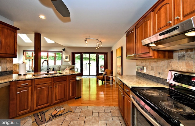2415 Schaffer Rd, Pottstown, PA 19464 - kitchen featuring stainless steel range with electric cooktop, a sink, under cabinet range hood, light stone counters, and recessed lighting