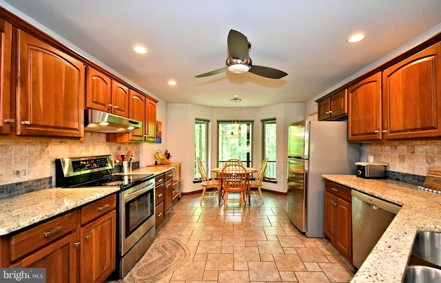 2415 Schaffer Rd, Pottstown, PA 19464 - kitchen featuring stainless steel appliances, under cabinet range hood, light stone countertops, ceiling fan, and recessed lighting
