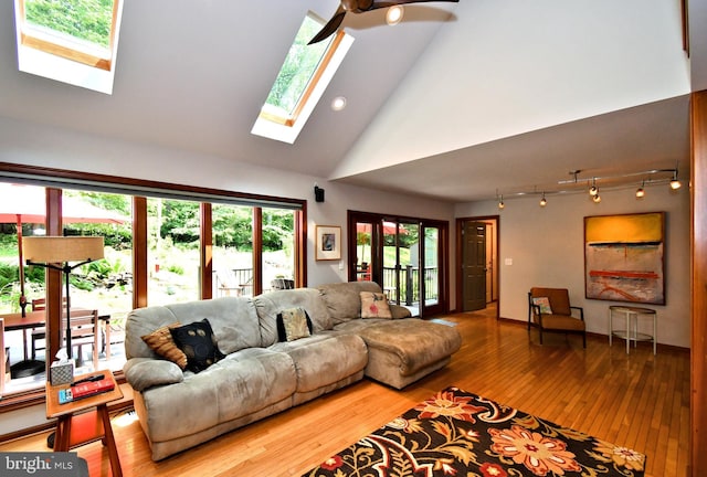 2415 Schaffer Rd, Pottstown, PA 19464 - living area featuring a skylight, hardwood / wood-style floors, high vaulted ceiling, a ceiling fan, and recessed lighting