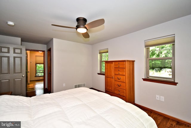 2415 Schaffer Rd, Pottstown, PA 19464 - bedroom with multiple windows, wood finished floors, and baseboards