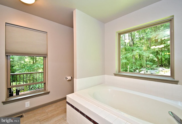 2415 Schaffer Rd, Pottstown, PA 19464 - bathroom featuring a bath, wood finished floors, and baseboards