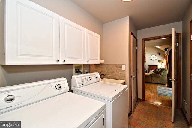 2415 Schaffer Rd, Pottstown, PA 19464 - laundry area featuring cabinet space, washer and clothes dryer, and light wood-type flooring