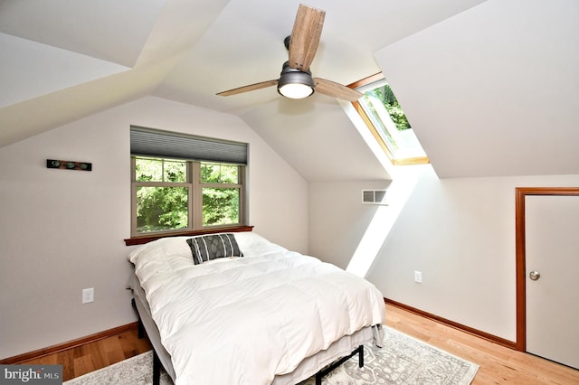 2415 Schaffer Rd, Pottstown, PA 19464 - bedroom featuring light wood-type flooring, vaulted ceiling, a ceiling fan, a skylight, and baseboards